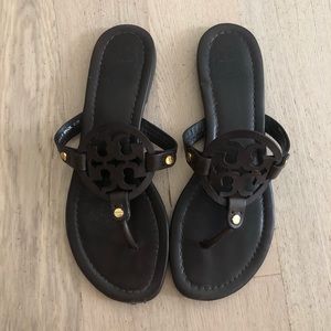 Tory Burch Miller Flip Flops in dark brown.